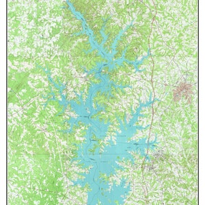 May include: A vintage topographic map of Lake Norman, North Carolina, from 1970. The map shows the lake's shape, surrounding land, and various features like roads, rivers, and elevation contours. The map is printed in shades of green, blue, and brown.