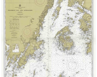 May include: A nautical chart of Penobscot Bay and Approaches in Maine. The chart is printed on a beige background with black lines and text. The chart includes a compass rose, depth soundings, and navigational aids.