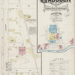 May include: A vintage map of Gadsden, Alabama, published by Sanborn Map & Publishing Co. in January 1885. The map shows the layout of the city with streets, buildings, and landmarks. The map is in black and white with some color accents.