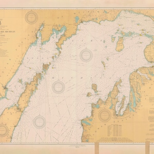 May include: A vintage nautical chart of the North End of Lake Michigan, Green Bay. The chart is printed on a cream-colored paper with brown and blue lines and text. The chart includes a compass rose, depth soundings, and navigational aids.