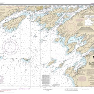 May include: A detailed nautical chart of Clayton to False Ducks Island, Lake Ontario, New York. The map features landmasses in tan and water areas in blue, with numerous navigational markers and text. The chart includes a compass rose and depth soundings.