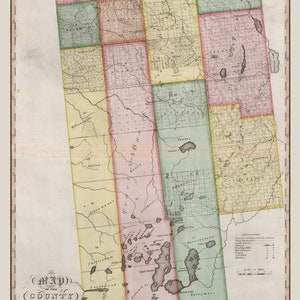 May include: A vintage map of the County of Franklin, New York, published by David H. Burr in 1838. The map is divided into townships and shows the location of lakes, rivers, and roads. The map is printed in shades of green, yellow, pink, and brown.