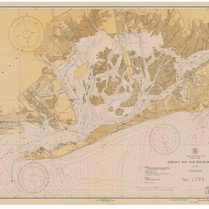May include: A vintage nautical chart of Jamaica Bay and Rockaway Inlet, New York. The chart is printed on a cream-colored paper with brown and red lines. The chart includes a compass rose, depth soundings, and various navigational markers.