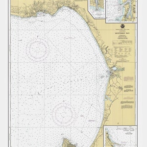May include: A nautical chart of Monterey Bay, California, showing depths in fathoms. The chart includes detailed information about the coastline, harbors, and other navigational features. The chart is printed on a cream-colored background with blue lines and text.