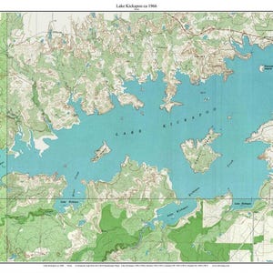 May include: A vintage topographic map of Lake Kickapoo from 1966, featuring a detailed depiction of the lake and surrounding terrain. The map uses a palette of blue, green, and brown, with contour lines indicating elevation changes. The title "Lake Kickapoo ca 1966" is at the top.