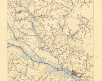 May include: A vintage map of the Chodowinity Quadrangle in North Carolina. The map shows rivers, roads, and other geographical features. The map is printed on cream-coloured paper with blue lines and text.