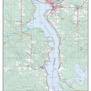 May include: A topographic map of Lac Mégantic, Quebec, Canada, showing the lake, surrounding towns, and roads. The map is dated 1990-2000.