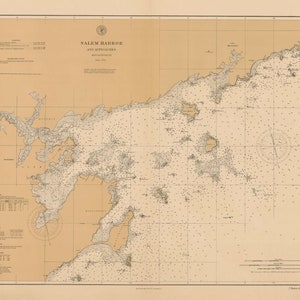 May include: A vintage nautical chart of Salem Harbor and Approaches, Massachusetts. The chart is printed on a cream-colored paper with brown lines and text. The chart shows the coastline, islands, and depths of the harbor.