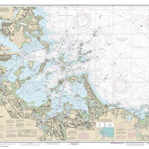 May include: A nautical chart of Boston Harbor, Massachusetts, showing the coastline, islands, and waterways. The chart includes depth soundings, navigational aids, and other important information for boaters. The chart is printed in black and white with blue and red accents.