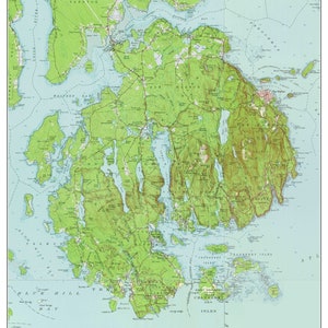 May include: A vintage topographical map of Mount Desert Island, Maine, from 1960. The map shows the island's coastline, roads, and various geographical features. The map is printed on a light blue background with green and brown lines and text.