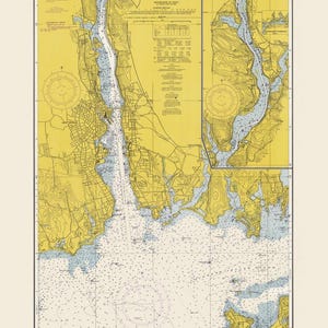May include: A vintage nautical chart of the Thames River, New London Harbor, and Long Island Sound to Norwich. The map features detailed coastlines, water depths, and navigational information. The chart is in shades of yellow, blue, and white, with text that reads "Thames River, New London Harbor, Long Island Sound to Norwich."