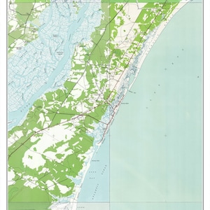 May include: A vintage map of Pawleys Island, South Carolina, circa 1942. The map shows the coastline, waterways, and surrounding land. The map is in shades of blue, green, and brown.