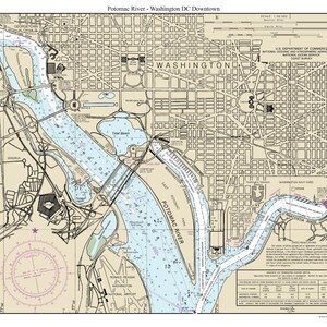 May include: A nautical chart of the Potomac River in Washington, D.C. The chart shows the river's course, islands, and landmarks, including the Washington Navy Yard, the Tidal Basin, and the Ronald Reagan Washington National Airport. The chart also includes a compass rose and a scale bar.