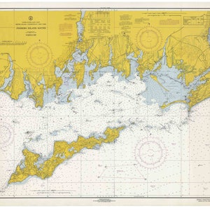 May include: A nautical chart of Fishers Island Sound, New York, with detailed markings for navigation. The chart is yellow and blue, with a compass rose in the upper left corner. The chart is labeled "Fishers Island Sound" and "C.&G.S. 528".