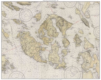 May include: A vintage nautical chart of the San Juan Islands, Washington State, with detailed coastline and island features. The chart includes depth soundings, navigational aids, and other important information for mariners. The title "Nautical Chart of the San Juan Islands 1913" is printed at the top.