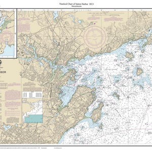 May include: A nautical chart of Salem Harbor, Massachusetts, dated 2013. The map features detailed coastal topography, water depths in feet, and navigational markers. An inset map shows Manchester Harbor. The chart includes text labels.