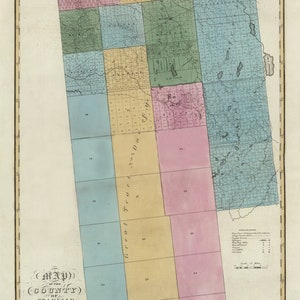 May include: A vintage map of Franklin County, New York, from 1829. The map is divided into numbered townships and shows the boundary line between the United States and Canada. The map is printed in black and white with colored sections.