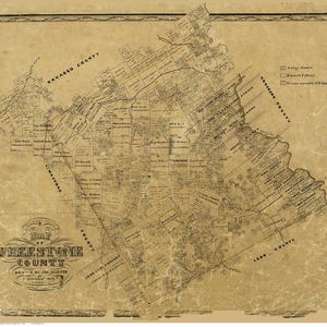 May include: An antique map of Freestone County, Texas, drawn by J. Martin in February 1858. The map shows the county's boundaries, roads, and towns. The map is printed on aged paper with a faded brown color.