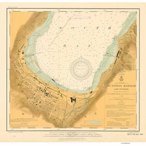 May include: A vintage map of Munising Harbor on Lake Superior, Michigan. The map is printed on a cream-colored paper with brown and blue lines. The map shows the harbor, the surrounding land, and the city of Munising. The map is dated 1911.