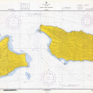 May include: A nautical chart of Santa Cruz Channel, California, showing the islands of Santa Cruz and Santa Rosa. The chart is yellow and blue and includes depth soundings and navigational aids.