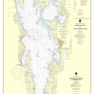 May include: A nautical chart of Lake Champlain, New York, from 2013. The chart shows the lake's shoreline, islands, and depths. The chart is divided into three sections: Cumberland Head to Four Brothers Islands, Four Brothers Islands to Barber Point, and Barber Point to Whitehall. The chart also includes a compass rose and a scale bar.