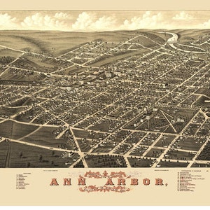 May include: An antique bird's-eye view map of Ann Arbor, Michigan, from 1873. The map shows the city's streets, buildings, and landmarks in detail. The map is printed in black and white and has a vintage aesthetic.
