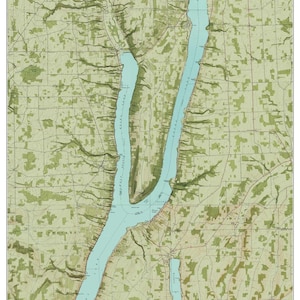 May include: A vintage map of Keuka Lake, New York, from around 1953. The map shows the lake's shape, surrounding land, and nearby towns. The lake is colored blue, and the land is green.