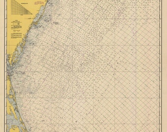 May include: A vintage nautical chart of the coastline from Cape May to Cape Hatteras, featuring a grid pattern and detailed markings. The chart is printed on a cream-colored paper with a yellowed tint. The title "Cape May to Cape Hatteras" is printed at the bottom of the chart.