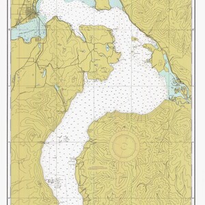 May include: A nautical chart of Lake Pend Oreille in Idaho, showing depth soundings in feet. The chart is a yellow and blue color scheme with black lines and text. The chart includes a compass rose and a scale bar.