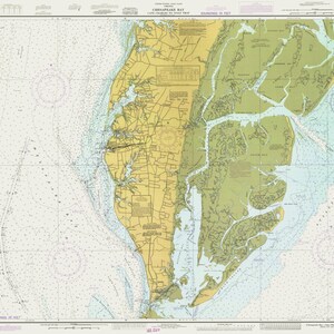 May include: A nautical chart of Chesapeake Bay, Cape Charles to the mouth of the York River. The chart shows depths in feet and includes details of the coastline, waterways, and islands. The chart is printed on a light blue background with yellow and green markings.