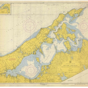 May include: A vintage nautical chart of New York - Long Island, Shelter Island Sound and Peconic Bays. The chart is printed on paper and shows the coastline, waterways, and islands in the area. The chart is in a light yellow and blue color scheme.