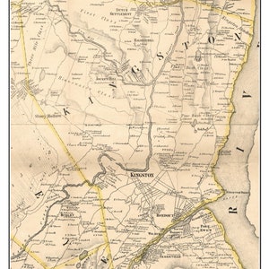 May include: An antique map of Kingston, New York, from 1858. The map shows the town's streets, roads, and landmarks, including the Rondout Creek, the Hudson River, and the town's center. The map is printed in black and white with yellow highlights.