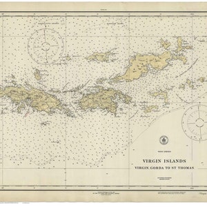 May include: A vintage nautical chart of the Virgin Islands, showing the islands of Virgin Gorda to St. Thomas. The chart is printed on a cream-colored paper with brown and black lines and text. The chart includes a compass rose and a scale bar.