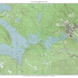 May include: A vintage topographic map of Twin Lakes and Millinocket, Maine, from 1988. The map shows the lakes, surrounding forests, and the town of Millinocket. The map is printed in green, blue, and brown.