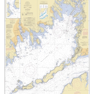 May include: A nautical chart of Buzzards Bay, Massachusetts, showing the coastline, islands, and waterways. The chart includes depth soundings, navigational aids, and other important information for boaters. The chart is printed in black and white with blue and red accents.