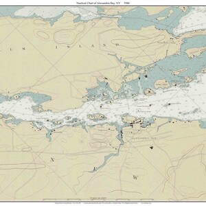 May include: A vintage nautical chart of Alexandria Bay, NY, from 1946. The chart shows the coastline, islands, and waterways of the area. The chart is printed in black and white on a cream-colored background.