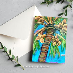 May include: A rectangular greeting card featuring a vibrant painting of a palm tree with green fronds and brown coconuts against a bright blue sky. The word aloha is printed in the lower right corner, and the artist's signature is visible below.