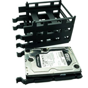 May include: A black plastic hard drive rack with three slots for hard drives. A Western Digital 640GB hard drive is in one of the slots.