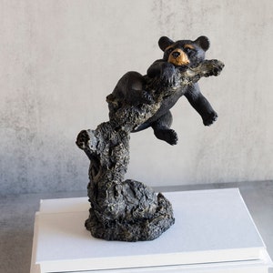 North American Black Bear Cub in a Tree Sculpture