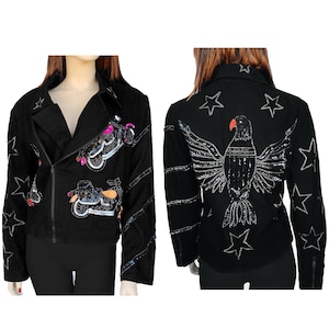 May include: Black leather jacket with a zipper closure and embellished with sequined designs of motorcycles and stars on the front and a sequined eagle on the back.