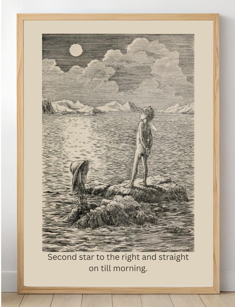 May include: A framed black and white print depicting a figure standing on rocks, gazing at the moon and clouds over water. The print includes the text "Second star to the right and straight on till morning."