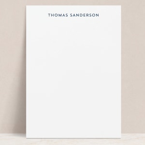 May include: White stationery with a blue header that reads "THOMAS SANDERSON".