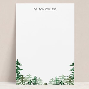 May include: White stationery with the name "Dalton Collins" printed at the top. The bottom of the page features a watercolor illustration of a forest with green trees.