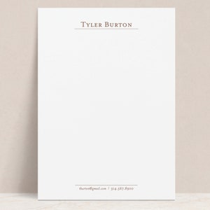 Könnte beinhalten: Ein weißer Briefkopf mit dem Namen "Tyler Burton" oben und den Kontaktdaten unten.