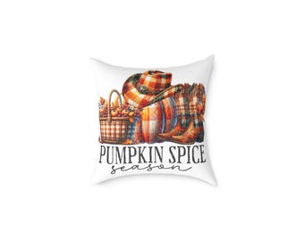 May include: White throw pillow with a fall-themed design. The design includes a pumpkin, cowboy boots, a basket of fruit, and a plaid hat. The words "PUMPKIN SPICE season" are written in black script.