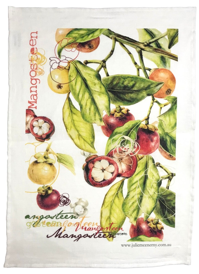 May include: A white tea towel with a watercolor illustration of mangosteens on a branch with green leaves. The text "Mangosteen" is repeated in various sizes and orientations on the towel. The text "www.juliemccernry.com.au" is printed in the bottom right corner.