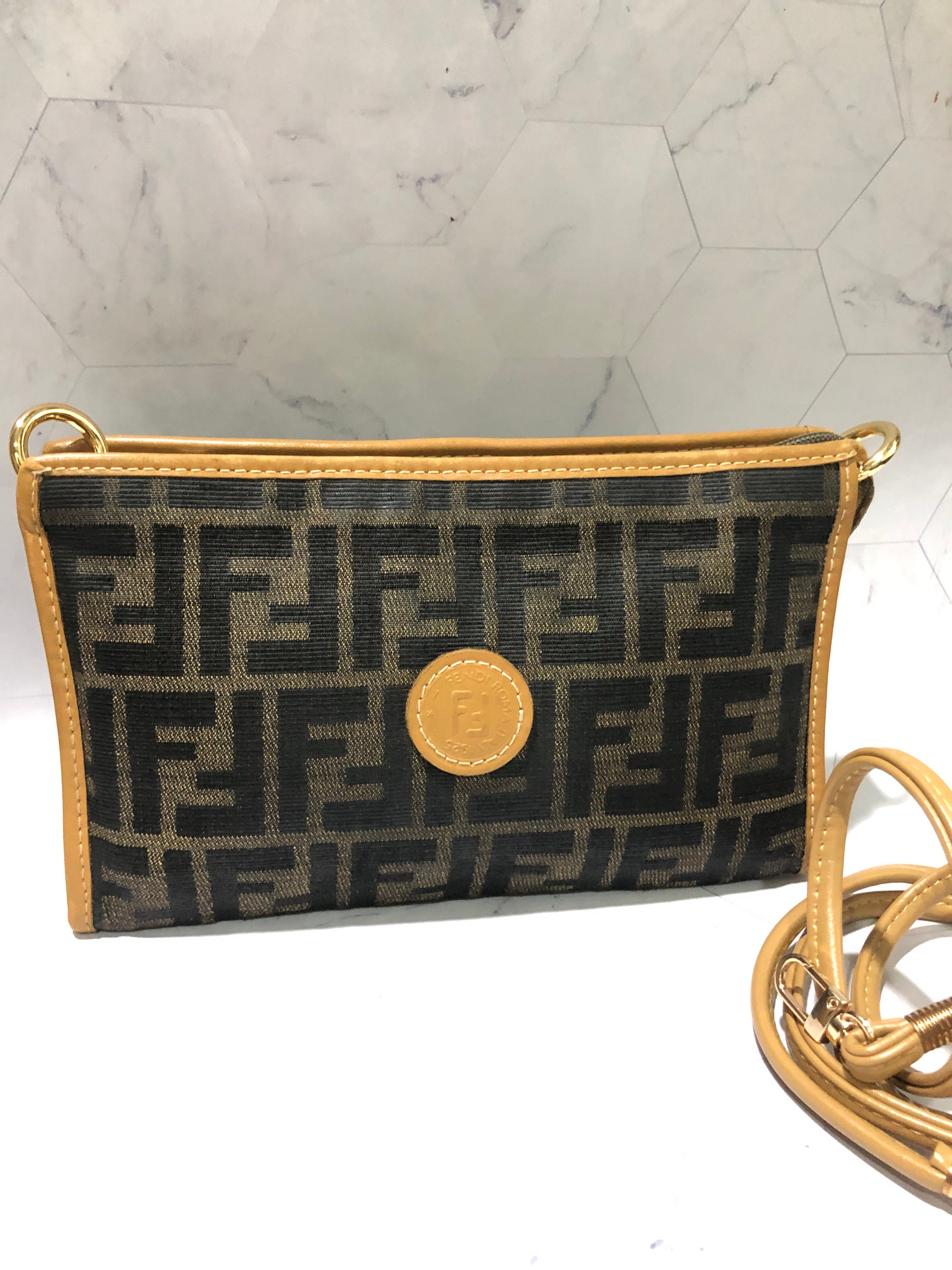Fendi Outlet: clutch in leather and coated canvas with FF monogram