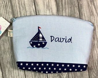 Toiletry bag with name sailing boat blue