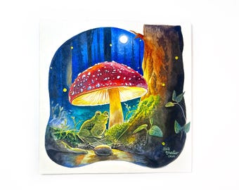 Puede incluir: Una pintura de acuarela que representa una rana verde sentada cerca de un hongo rojo grande y brillante con manchas blancas. La escena está ambientada en un bosque azul oscuro de noche con una luna brillante, luciérnagas y un tronco de árbol. Firmado Kait Amadio 2026.