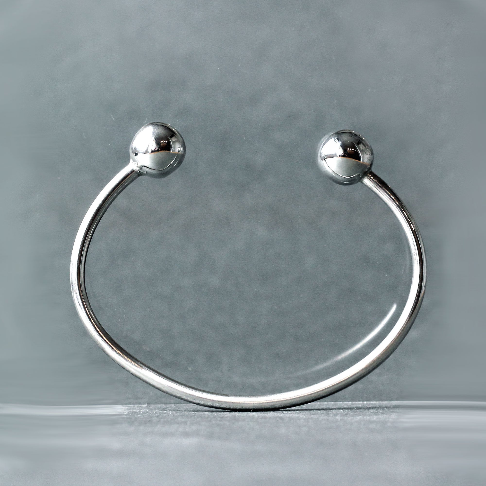 Silver bracelet with balls on end online